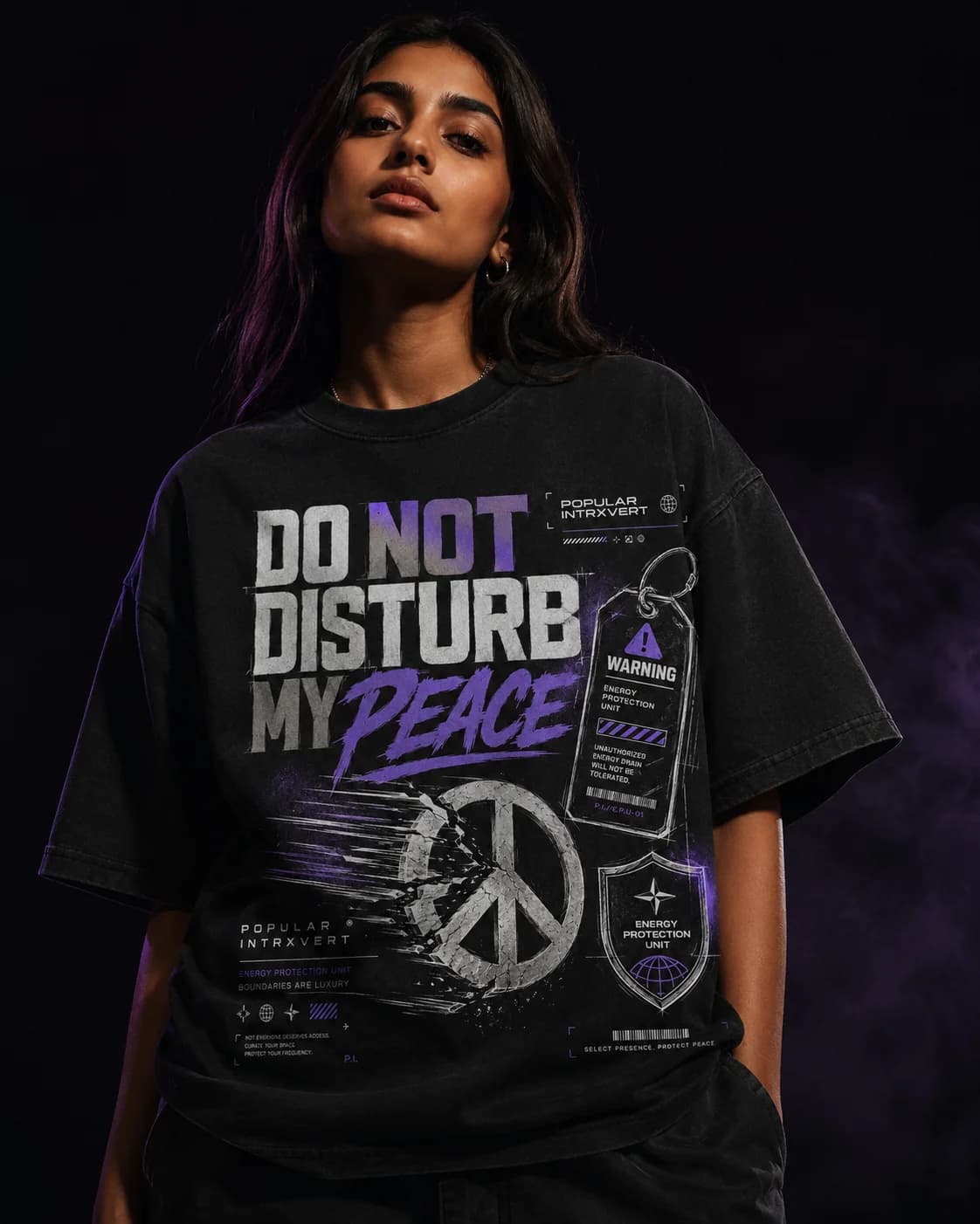 Model wearing the Popular Intrxvert Do Not Disturb My Peace tee